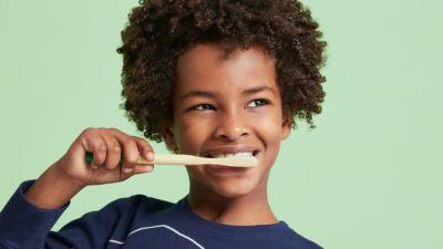 Cute kids brushing teeth with Schmidt's Kids Toothpaste in Watermelon+Strawberry